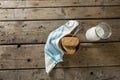 Granola bar and milk with napkin on wooden table Royalty Free Stock Photo