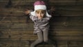 Overhead happy smiling child girl with hat portrait on vintage wooden background.Text or logo copy space.Vertical top