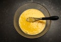 Overhead image of whisked eggs in a glass bowl Royalty Free Stock Photo