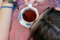 Overhead image of a young woman sipping tea Royalty Free Stock Photo