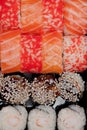 Overhead japanese sushi food. Rolls with tuna, salmon, shrimp, crab and avocado. Top view of assorted sushi, all you can eat menu Royalty Free Stock Photo