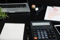 Overhead of office table with notebook, computer keyboard, calculator Royalty Free Stock Photo