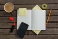 Organizer, coffee, mobile phone and stationery on wooden plank Royalty Free Stock Photo