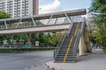 Overhead pedestrian crossing view of the stairs above the highway city road.