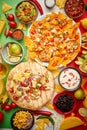 An overhead photo of an assortment of many different Mexican foods on a table