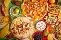 An overhead photo of an assortment of many different Mexican foods on a table