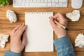 Overhead photo of blank notepad paper hands pen plant computer keyboard and mouse isolated on the wooden backdrop