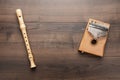 Overhead photo of block flute and kalimba with copy space