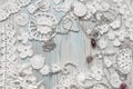 An overhead photo of cotton creative Irish crochet lace white flowers and pearls. Handmade knitted Easter, Christmas, Valentine Royalty Free Stock Photo