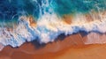 Overhead photo of crashing waves on the shoreline