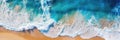 Overhead photo of crashing waves on the shoreline. Tropical beach surf. Abstract aerial ocean view.