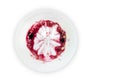 An overhead photo of dirty bowl with the oatmeal porridge and bilberry jam leftovers. on white. Messthetics aesthetic con