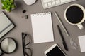 Overhead photo of empty notebook keyboard computer mouse magnifier pens phone plant glasses cup of coffee and paperclips isolated Royalty Free Stock Photo