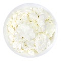 An overhead photo of fresh natural cottage cheese in a white ceramic bowl isolated on white. Organic eco healthy meal, dairy