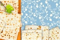 An overhead photo of Jewish matzah on the chopping board. The illustration of linden tree branch and matzah for jewish passover. H