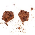 An overhead photo of a messy chocolate muffin, cut into halves, with crumbs