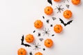 Overhead photo of pile of pumpkins spiders web and bats isolated on the white background