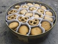 An overhead photo of a tin can of Danish butter cookies, shot from above on a light background texture with a place for text Royalty Free Stock Photo