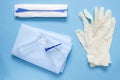 An overhead photo of the vaginal speculum, napkin, medicine gloves and spatula. The medical tools for holding open the vagina duri Royalty Free Stock Photo