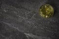 An overhead photograph of a glass of golden Whiskey with ice on a marble rock background Royalty Free Stock Photo