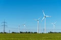 Overhead power lines and wind power plants Royalty Free Stock Photo