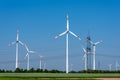 Overhead power lines and wind power plants Royalty Free Stock Photo