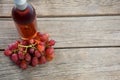 Overhead of red bunch of grapes with bottle of red wine Royalty Free Stock Photo