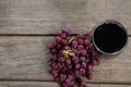 Overhead of red bunch of grapes with glass of red wine Royalty Free Stock Photo