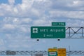Overhead road direction signs showing way to Orlando international airport