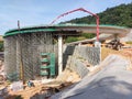 Overhead road under construction. The massive concrete column used to support the concrete road deck.