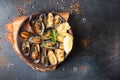 Overhead of seafood dinner table. Grilled baked mussels with but