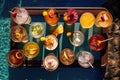 overhead shot of assorted cocktails on poolside tray