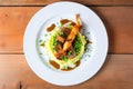 overhead shot of bangers and mash with peas on a plate