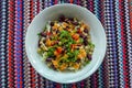 Overhead shot of bean, carrot, parsley, red bell pepper, cabbage, and chickpea salad bowl Royalty Free Stock Photo