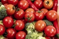 Overhead shot of bulk tomatoes, broccoli and red hot chili peppers Royalty Free Stock Photo