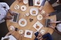 Overhead Shot Of Businesspeople Meeting In Coffee Shop Royalty Free Stock Photo