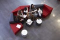 Overhead Shot Of Businesswomen Meeting In Lobby Of Office Royalty Free Stock Photo