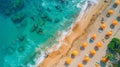 Aerial View of Sunny Beach with Colorful Umbrellas and Swimmers