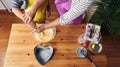 Overhead shot of a Caucasian mother teaching her son to cook and preparing the ingredients to make a cake