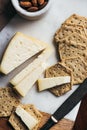 Overhead shot of a cheeseboard with mature cheddar and hexagon gluten free crackers