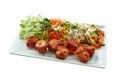 Chicken Tikka Brochette on white plate