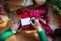 Overhead shot of Christmas presents and wrapping papers