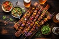 overhead shot of craft beer and grilled skewers