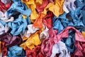 overhead shot of crumpled paper strips in various colors