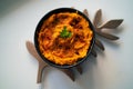 Overhead shot of a delicious bowl of curry on a white table