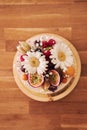 Overhead shot of the delicious decorative cake on a brown table