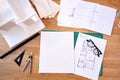 Overhead Shot Of Desk In Architects Office With Plans Drawing Instruments And Model Royalty Free Stock Photo