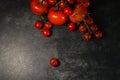Overhead shot of different types of tomatoes on the table under the lights Royalty Free Stock Photo