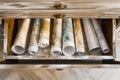 overhead shot of a drawer with rolledup canvases Royalty Free Stock Photo