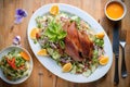 overhead shot of duck a lorange with side salad